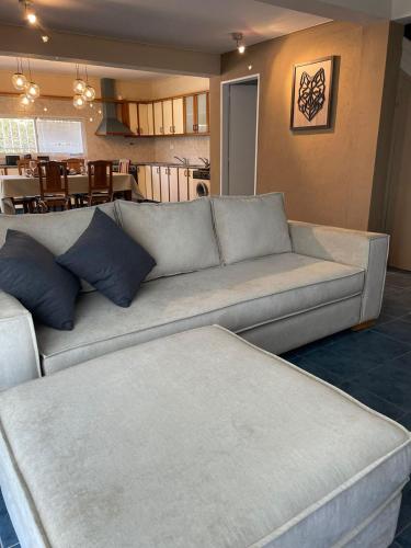 a living room with a couch and a dining room at CHACRAS Lodge in Mendoza