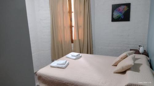 Postel nebo postele na pokoji v ubytování Acogedor departamento.