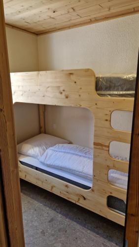 a bunk bed in a wooden room at TIGNES VAL CLARET A LA CONQUETE DES SOMMETS 116 in Tignes