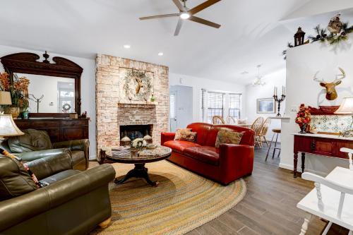 a living room with a couch and a fireplace at Antlers - A Birdy Vacation Rental in San Antonio