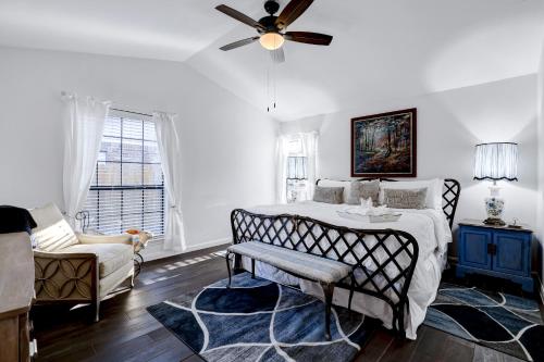 a bedroom with a bed and a ceiling fan at Antlers - A Birdy Vacation Rental in San Antonio