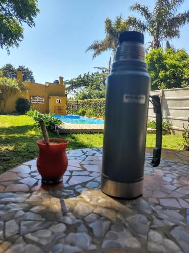 a large water bottle sitting on a stone table at Alma Mía in Lobos