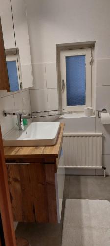 a bathroom with a sink and a bath tub at Schobermühle in Scharnstein
