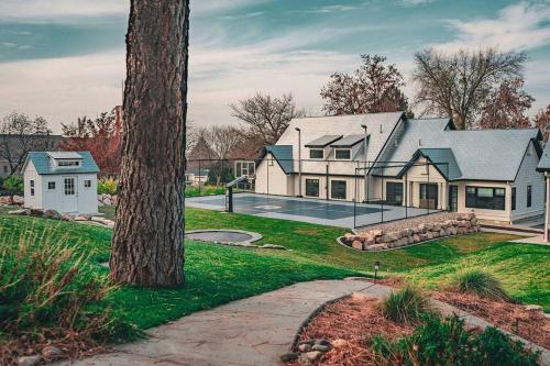 a large house with a tree in front of it at Guest House - 1 bedroom North Salt Lake Stay in Bountiful