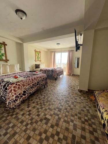 Una cama o camas en una habitación de Hotel y Restaurante Mama Ines