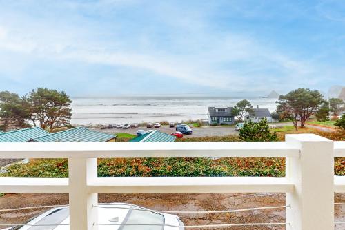 a view of the beach from the balcony of a house at Wave Watch `N in Oceanside