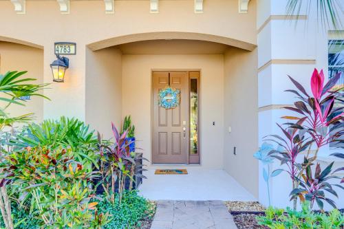 a front door of a home with plants at Luxury Family Villa 4 BR with 3 King Beds & Pool in Davenport