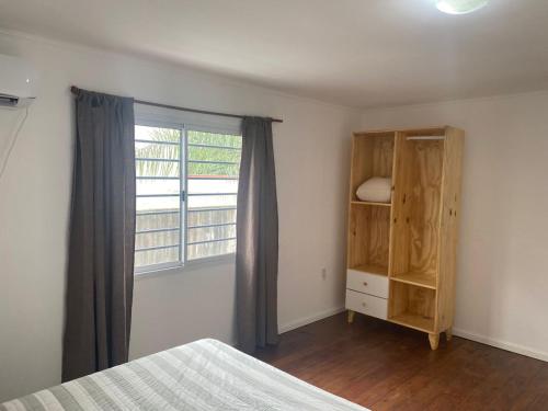 Giường trong phòng chung tại DEPARTAMENTO 2 Duplex equipado hasta 4 huéspedes