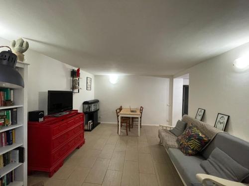 a living room with a couch and a table at Appartamento in the Heart of Tuscany in Monsummano