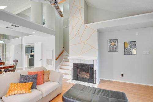 a living room with a couch and a fireplace at Pet-Friendly Carrollton Home with Fenced Backyard! in Carrollton