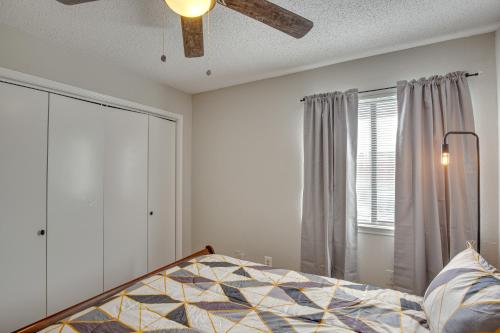 a bedroom with a bed and a ceiling fan at Pet-Friendly Carrollton Home with Fenced Backyard! in Carrollton