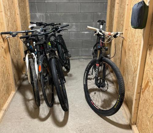 two bikes parked next to each other in a garage at Sentral v Nidelva in Trondheim