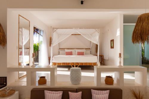 Ένα ή περισσότερα κρεβάτια σε δωμάτιο στο Kilombo Villas & Spa