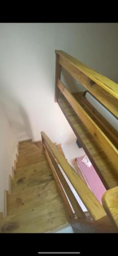 a set of wooden stairs in a room at Pousada Dona Carmem Ubatuba in Ubatuba