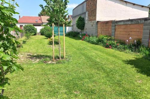 a garden with two trees in the grass at Bauernhaus mit großem Innenhof und Garten - ideal für große Gruppen in Seefeld-Kadolz