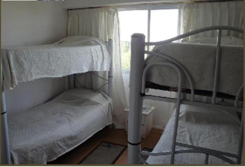 Krevet ili kreveti na sprat u jedinici u okviru objekta Apartamento en Punta del Este