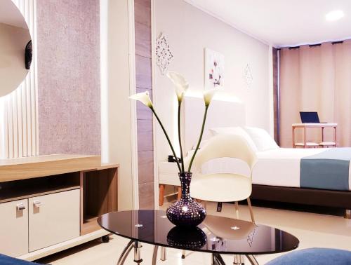 Postel nebo postele na pokoji v ubytování Hotel Suite Center Pereira