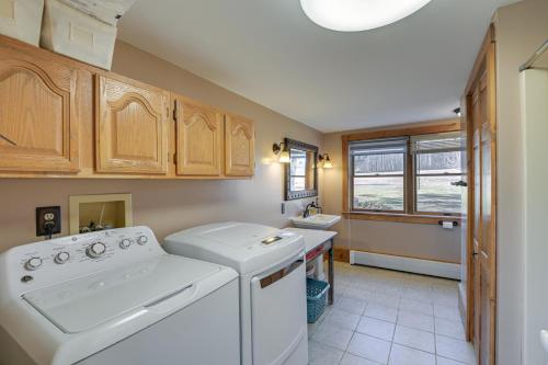 a kitchen with a washing machine and a sink at Quiet Bradford Retreat Near Hiking and Fishing! 