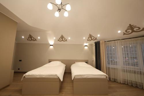 Postel nebo postele na pokoji v ubytování Cozy Hostel
