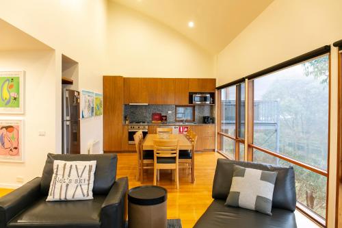 a living room with a couch and a table at Frueauf Village in Falls Creek