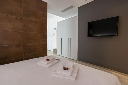 Televisyen dan/atau pusat hiburan di HTM Venice Suite by Halldis