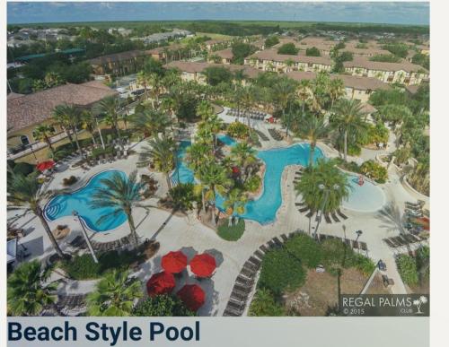 an aerial view of a beach style pool at a resort at Cozy Stylish Townhome in Davenport