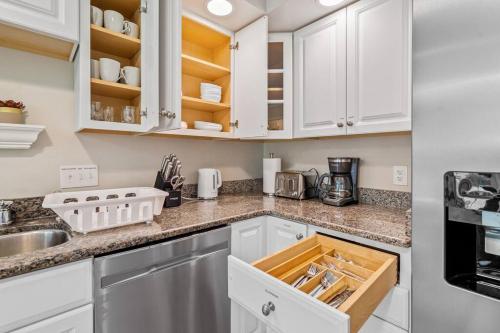 a kitchen with white cabinets and a sink at Beautiful Home Walking Distance to Elon University in Elon