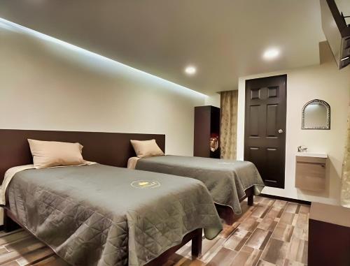Postel nebo postele na pokoji v ubytování Jovis Hotel - Lujo Cultural