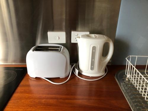a toaster and a toaster sitting on a table at Clare to Spalding character escape in Spalding