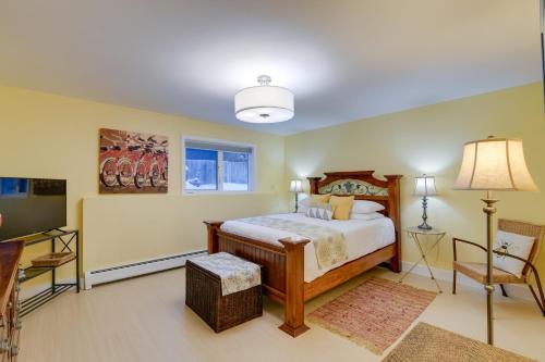 a bedroom with a bed and a table and a chair at Anchorage Vacation Rental Near Coastal Trail! in Anchorage
