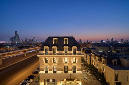 a building with a black roof on top of a building at Mansard Riyadh, a Radisson Collection Hotel in Riyadh