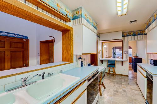 a kitchen with a large sink and a counter at Pacific Princess in Crescent City