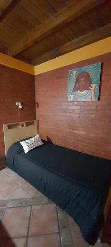 Una cama o camas en una habitación de Cabañas Akasha