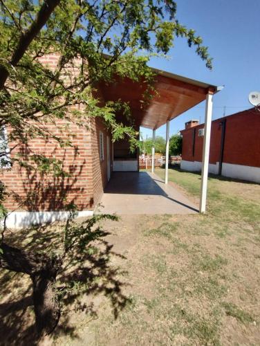 a garage with a brick building at Atardeceres del Valle in La Bolsa