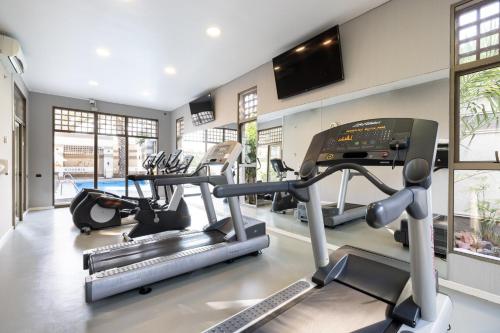 a gym with three treadmills and cardio machines at Holiday Inn Express - Antofagasta by IHG in Antofagasta