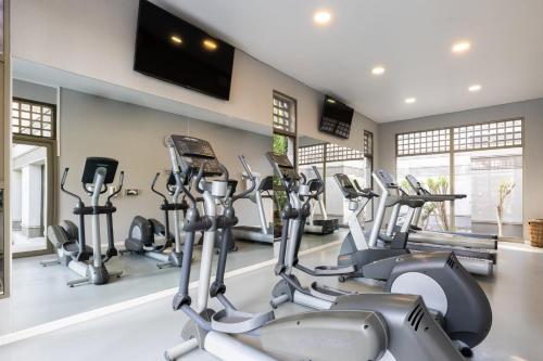 a gym with several cardio machines in a room at Holiday Inn Express - Antofagasta by IHG in Antofagasta