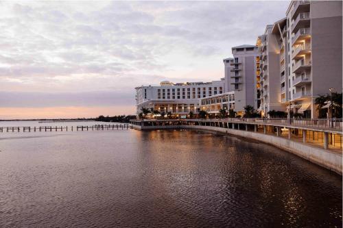 a view of buildings and a body of water at Sunseeker Resort Florida Gulf Coast, Curio Collection Hilton in Port Charlotte