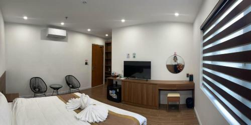 Μια τηλεόραση ή/και κέντρο ψυχαγωγίας στο Diamond Hotel Quảng Bình