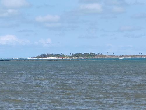 an island in the middle of a large body of water at Chalé Barra Sirinhaém in Sirinhaém