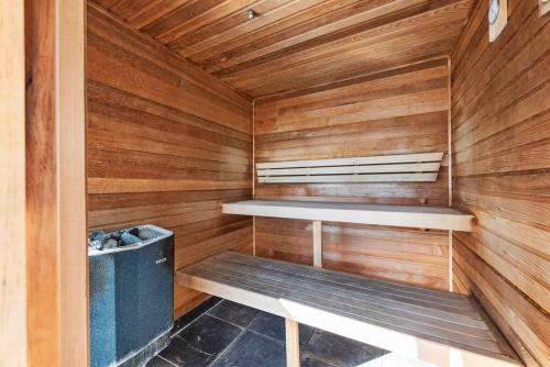 a sauna with a bench and a trash can at City Heights! 2Bed/1Bath/1Car/Views ~ CBD in Brisbane