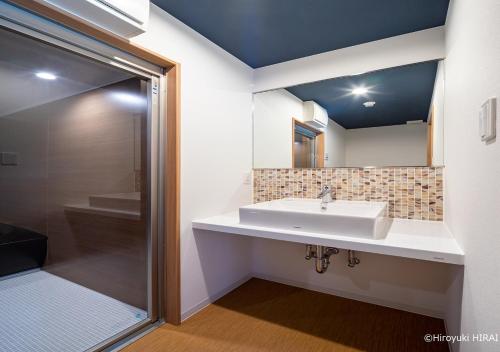 a bathroom with a sink and a shower at THE VIEW Odawara shiro-no mieru hotel - Vacation STAY 53335v in Odawara