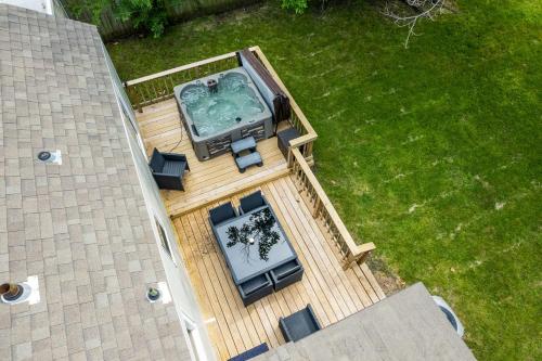 an overhead view of a deck with a swimming pool at Next to Expo, 5 beds, Hot-tub, corn hole, pets! in Tulsa