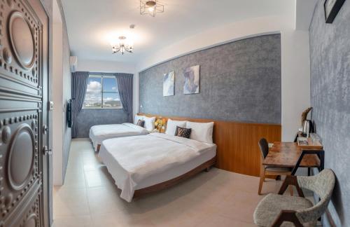 Postel nebo postele na pokoji v ubytování Ruisui Style B&B