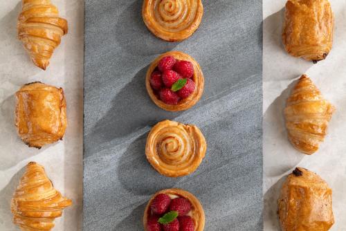 a group of four pictures of pastries with strawberries in them at Renaissance Xi'an Hotel in Xi'an