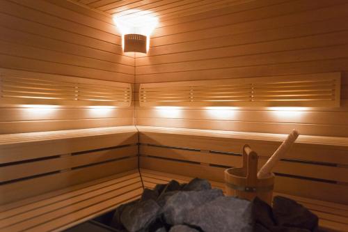 a sauna with a light on the inside of it at Grandhotel Ambassador Národní Dům in Karlovy Vary