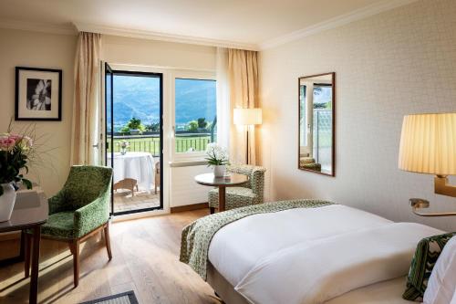 Ένα ή περισσότερα κρεβάτια σε δωμάτιο στο Park Hotel Sonnenhof - Relais & Châteaux