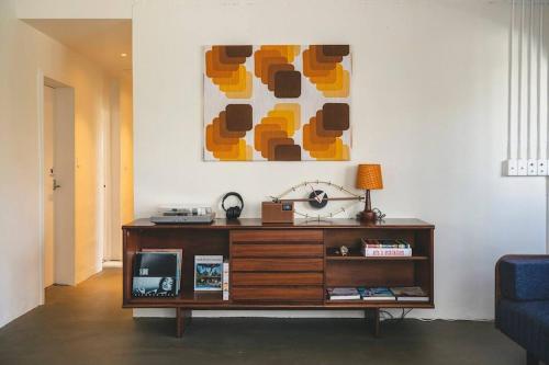 a living room with a couch and a table at Mid-Century House YOGI in Okinawa City