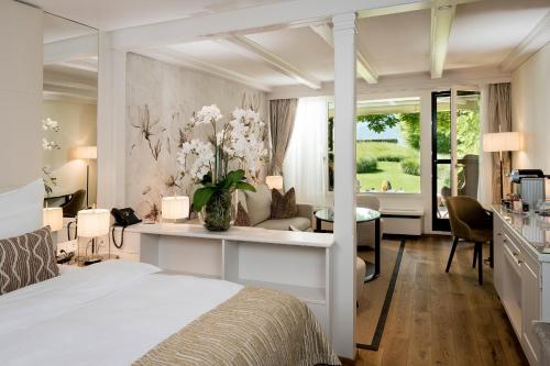 Postel nebo postele na pokoji v ubytování Park Hotel Sonnenhof - Relais & Châteaux