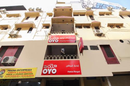 a building with a sign on the side of it at OYO Hotel Regal Near Paradise Circle in Secunderabad