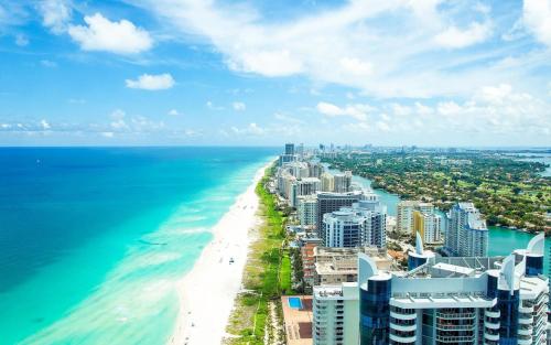 an aerial view of the beach and ocean at Entire Condo in Sunny Isles in Sunny Isles Beach